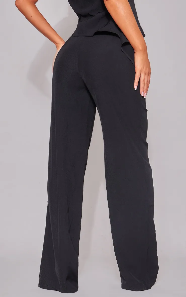 Pantalon de tailleur en maille tissée noire à taille haute