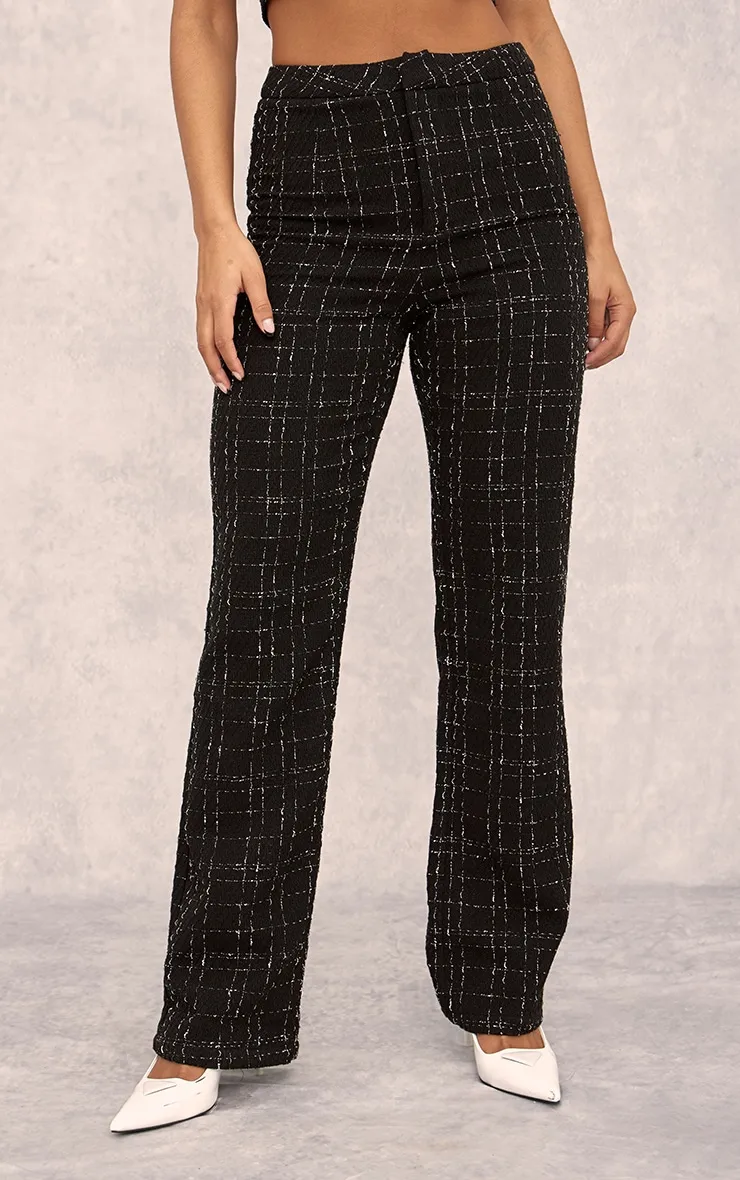 Pantalon de tailleur noir en maille bouclée à taille haute